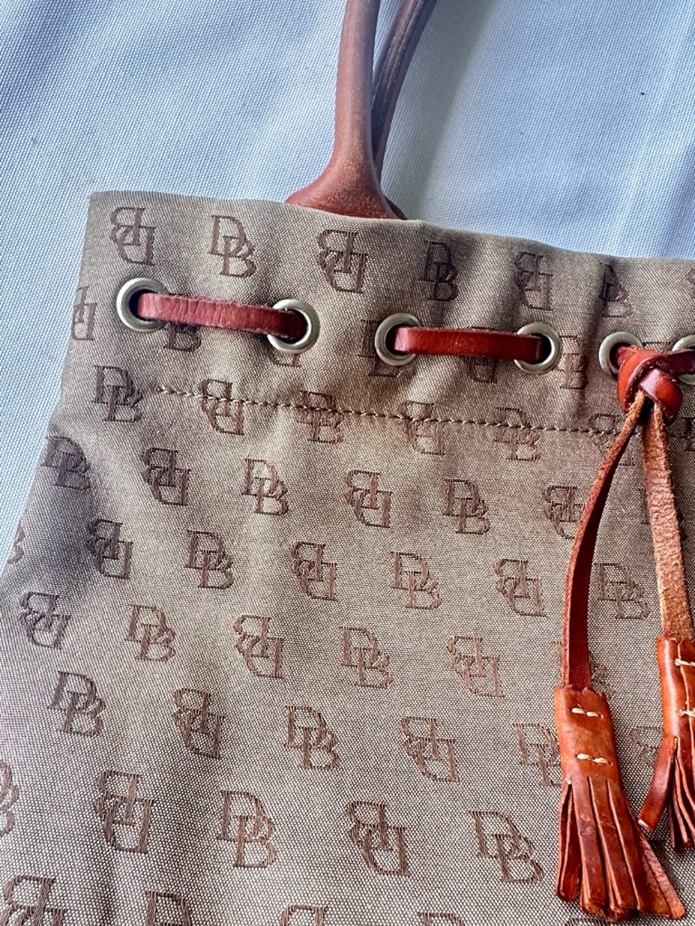 Dooney & Bourke monogram canvas and leather drawstring tote bag. - Picture 9 of 11